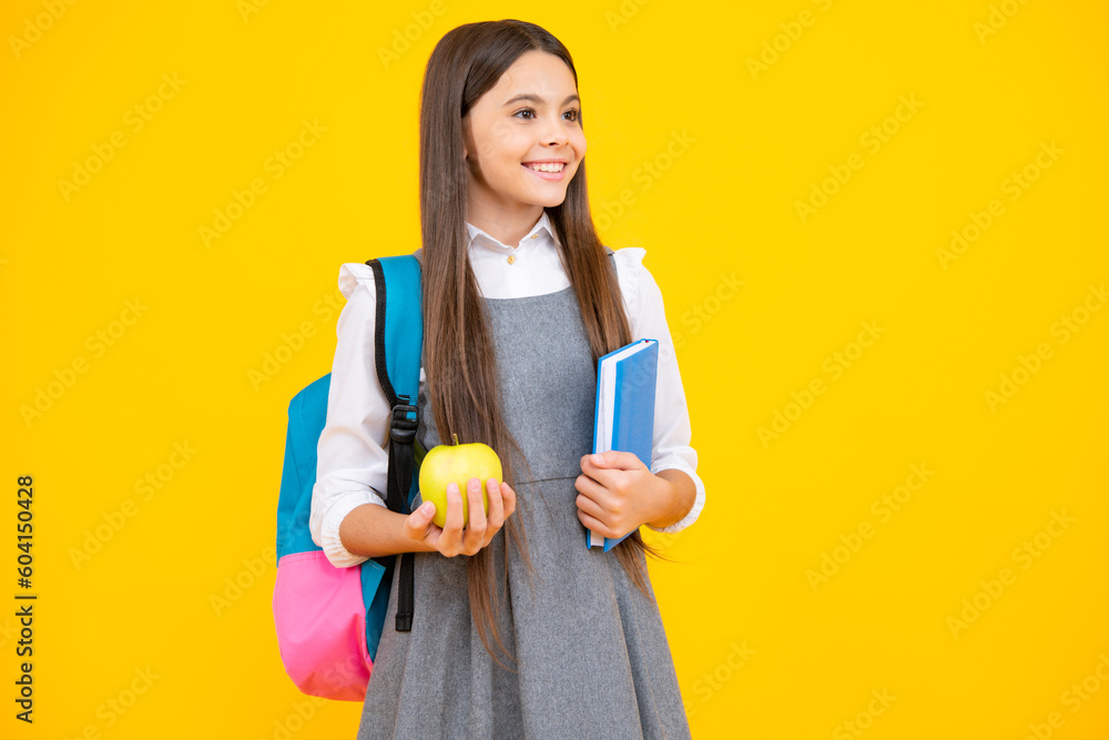 School teenager child girl 12, 13, 14 years old with book and copybook. Teenager schoolgirl on isolated background. Learning and knowledge education concept. School teenager child girl 12, 13, 14 years old with book and copybook. Teenager schoolgirl on isolated background. Learning and knowledge education concept.