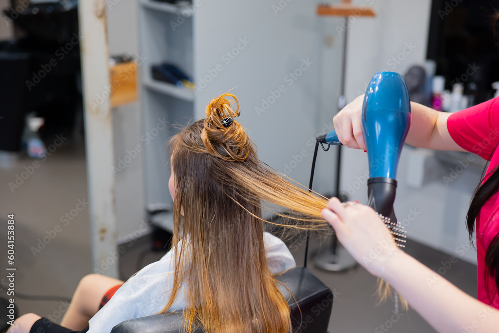 Fototapeta premium Drying long hair, barber shop