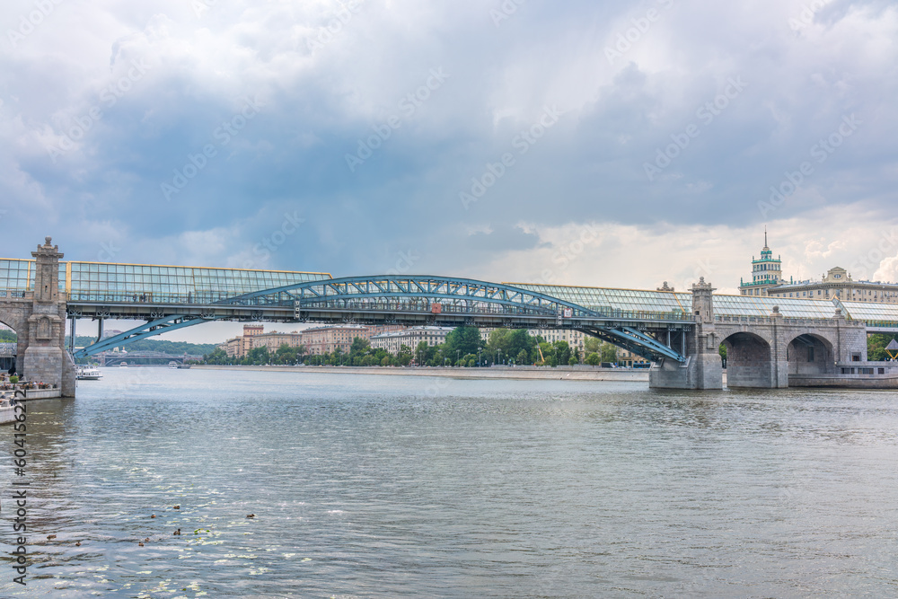 View of the Moscow river embakment, Pushkinsky bridge and cruise ships at sunset.