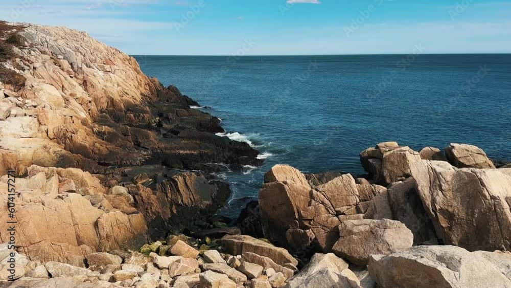 Seascape With Rocky Shore and Atlantic Ocean, Blue Ocean Panorama During the Day. Halifax, New Scotia, Canada. Sea Waves Crash Against the Rocky Shore. Seascape With Rocky Shore and Atlantic Ocean, Blue Ocean Panorama During the Day. Halifax, New Scotia, Canada. Sea Waves Crash Against the Rocky Shore.