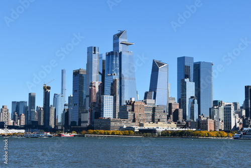 Manhattan skyscrapers view from the water, modern architecture of New York City landscape from the waterfront