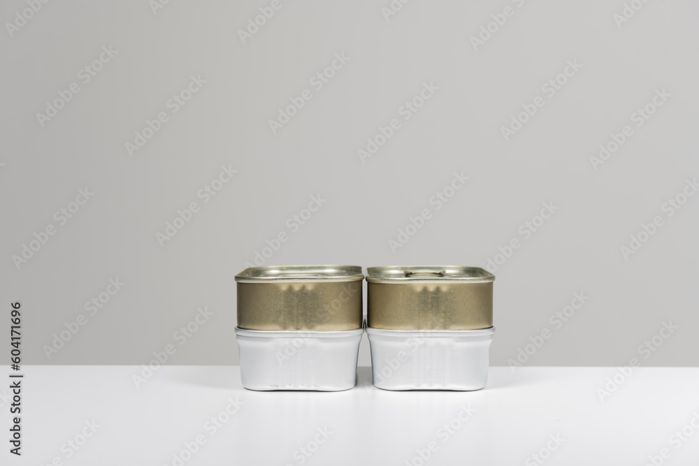 Some metal cans of different qualities of a simple rectangular Some metal cans of different qualities of a simple rectangular