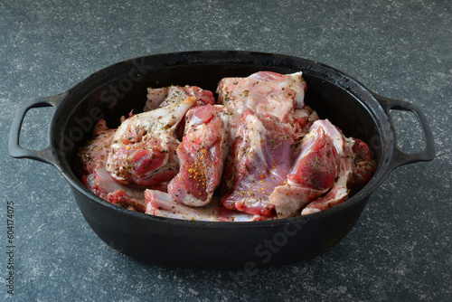 Seasoned lamb meat ready to roast, side view