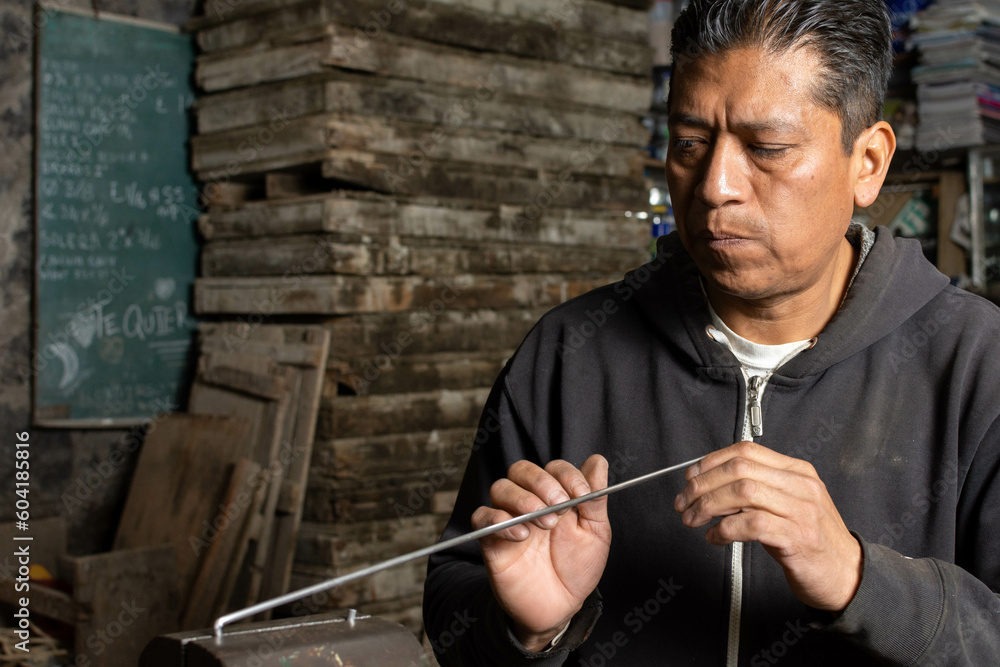 Precision in Action: Blacksmith Calculating and Straightening Metal Rod Precision in Action: Blacksmith Calculating and Straightening Metal Rod