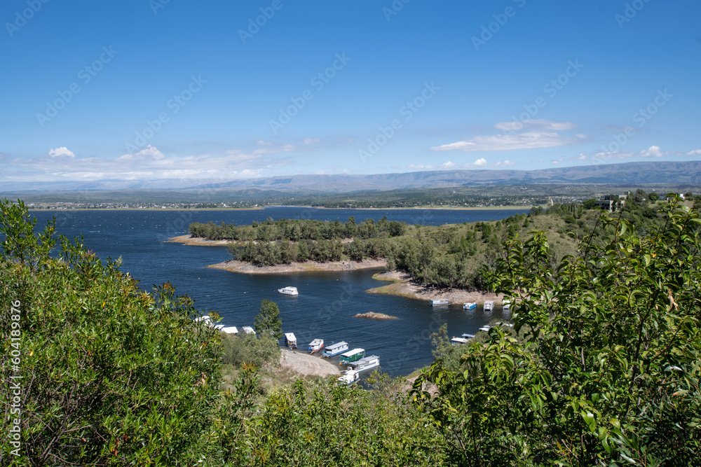 
Aerial view of Los Molinos Lake, Cordoba Argentina with rafts on the shore. No people. Daytime, clear sky.