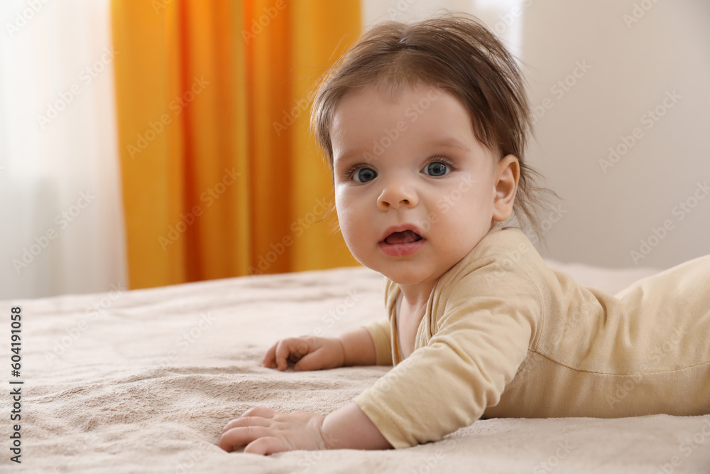 Portrait of cute little baby on bed indoors. Space for text Portrait of cute little baby on bed indoors. Space for text