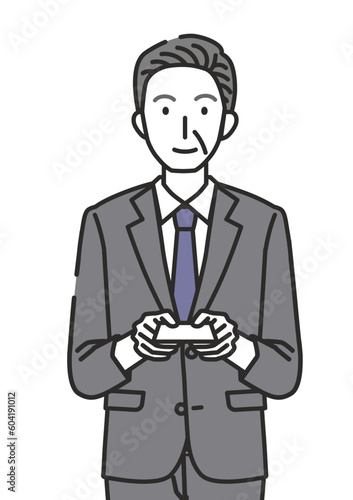 名刺を渡す60代・70代男性