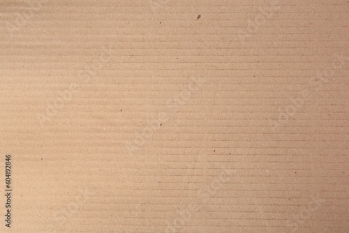 Texture of beige paper sheet as background, closeup