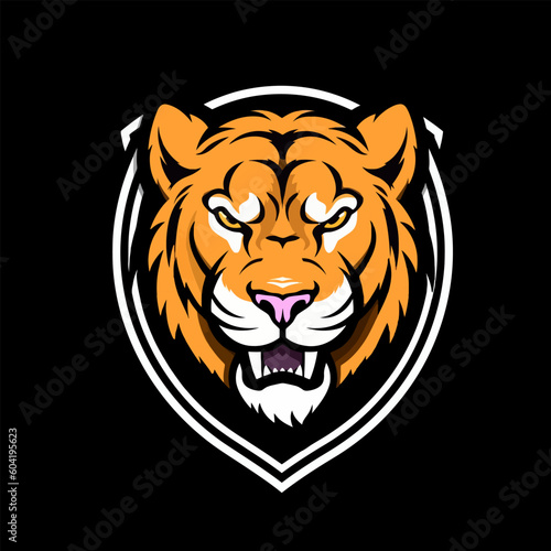 Fototapeta Naklejka Na Ścianę i Meble -  Tiger head mascot logo design vector with shield isolated on black background