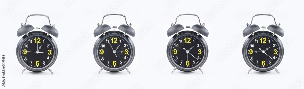 close up of a set of black alarm clocks showing the time; 1, 1.15, 1.30 and 1.45 p.m dan a.m. Isolated on white background
 - obrazy, fototapety, plakaty 