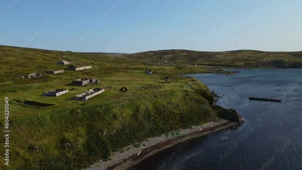 Aerial: abandoned old building on the shore of Shumshu Island Aerial: abandoned old building on the shore of Shumshu Island
