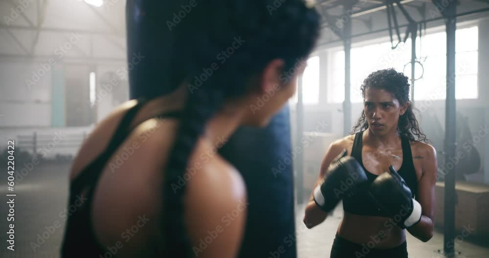 Boxing, personal trainer and learning with woman in gym for martial arts, workout and strong. Focus, health and cardio with female boxer in mma fitness center for training, exercise and performance Boxing, personal trainer and learning with woman in gym for martial arts, workout and strong. Focus, health and cardio with female boxer in mma fitness center for training, exercise and performance