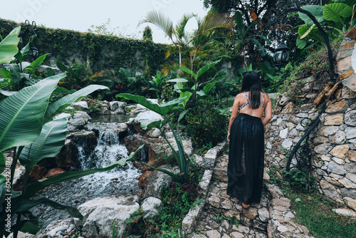 girl stand up in stars, looking at the waterfall in paradise Xilitla San Luis potosi photo