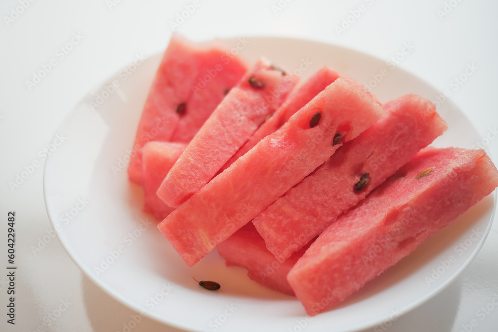 close up of slice of water melon on white background .