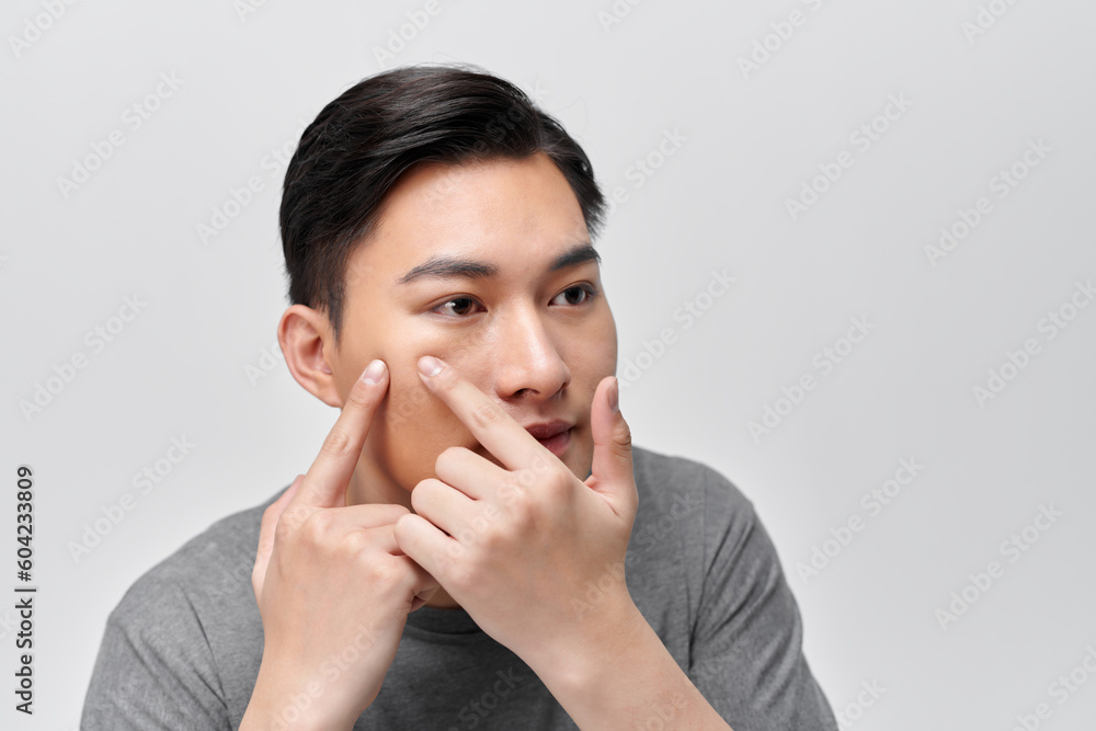 handsome young man Squeezing pimple handsome young man Squeezing pimple