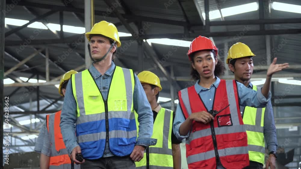 group of diversity Factory asian worker with Industrial Engineer inspector and african manager walking visit and checking mechanical in Manufacturing Facility teamwork meeting training and discussion group of diversity Factory asian worker with Industrial Engineer inspector and african manager walking visit and checking mechanical in Manufacturing Facility teamwork meeting training and discussion