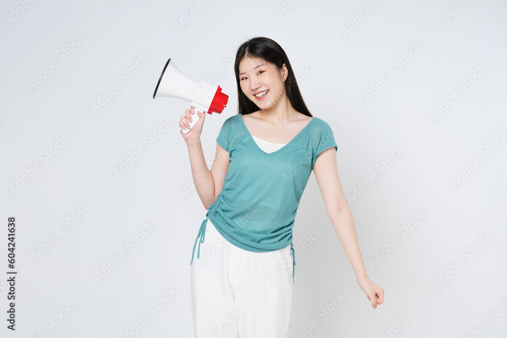 Young woman holding megaphone isolated on white background. Young woman holding megaphone isolated on white background.
