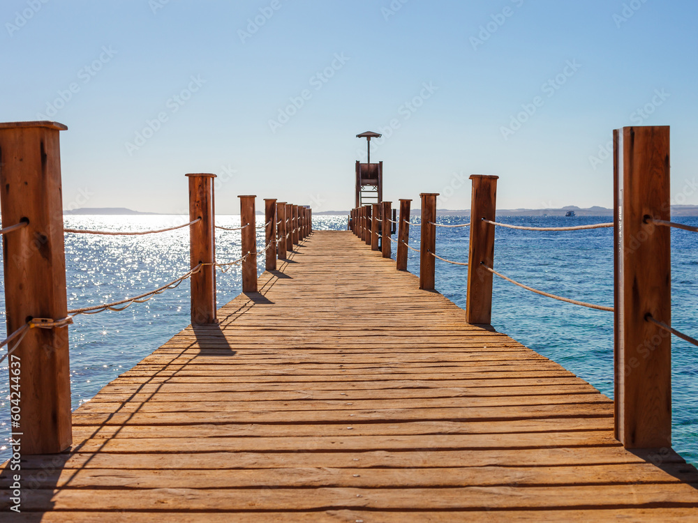 Pier on sunny beach on the Red Sea in Sharm el Sheikh, Sinai, Egypt