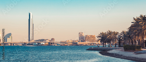 Photography Dubai Creek bay with skyscrapers and palm trees in UAE