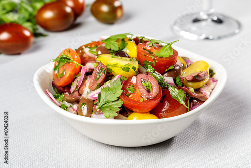 salad with tomatoes and hrebs