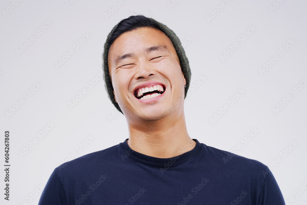 Casual, comedy and man laughing in a studio for joke, comic humor or funny story. Happiness, smile and face of an Asian male person with a positive and joyful facial expression by white background. Casual, comedy and man laughing in a studio for joke, comic humor or funny story. Happiness, smile and face of an Asian male person with a positive and joyful facial expression by white background.