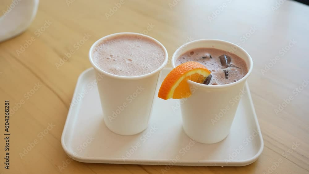 Pan View of Two Cups of Hot Dark Chocolate Served in Restaurant Pan View of Two Cups of Hot Dark Chocolate Served in Restaurant