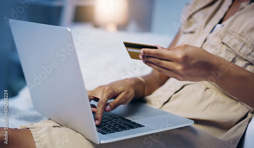 Credit card, woman hand and night in a bed with online shopping and computer with purchase. Bedroom, internet store and ecommerce deal of a female person in a home trying to pay on a web laptop app