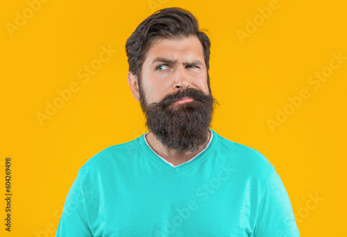 Wallpaper Mural portrait of worried bearded man. portrait of bearded man isolated on yellow. Torontodigital.ca