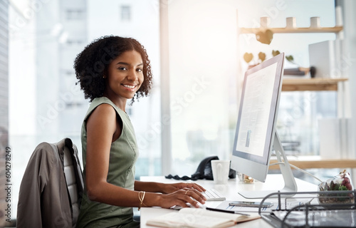 Black woman in business, computer screen and smile in portrait, working on corporate report or proposal. Data analyst, review of article and happy female employee in office with productivity