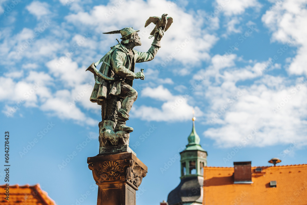 The old town of Altenberg. View of the old street near Lauenstein Castle. View of the bronze sculpture of a hunter in the central square