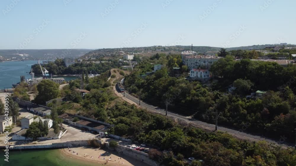 Sea bays of Sevastopol in Crimea during summertime in sunny weather. The aerial drone panoramic view an array of ships and boats, seaside tourism and travel destinations. Sea bays of Sevastopol in Crimea during summertime in sunny weather. The aerial drone panoramic view an array of ships and boats, seaside tourism and travel destinations.
