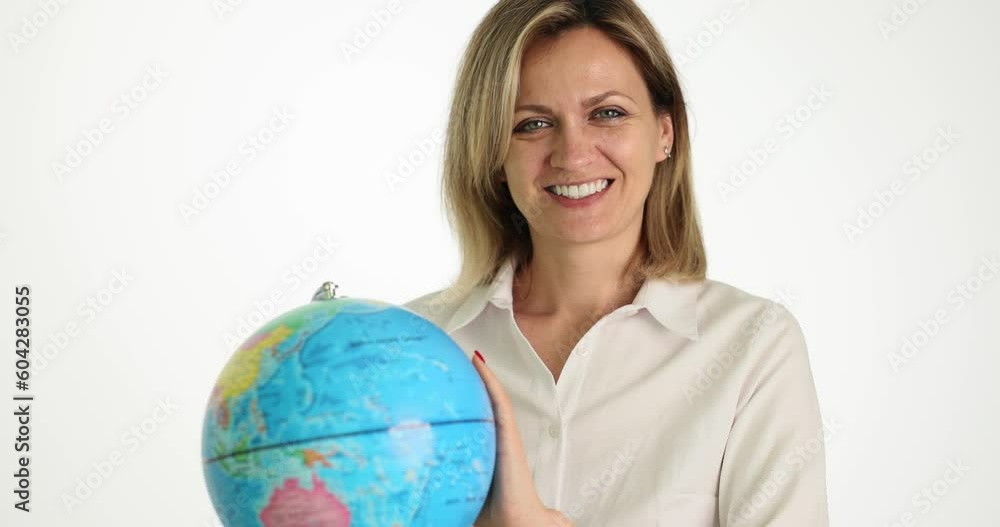 Smiling eco-activist woman gently spins globe. Girl protects planet from pollution, garbage and travels abroad Smiling eco-activist woman gently spins globe. Girl protects planet from pollution, garbage and travels abroad
