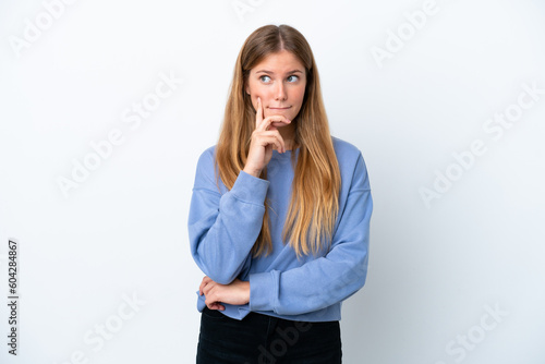 Young blonde woman isolated on white background having doubts and thinking © luismolinero