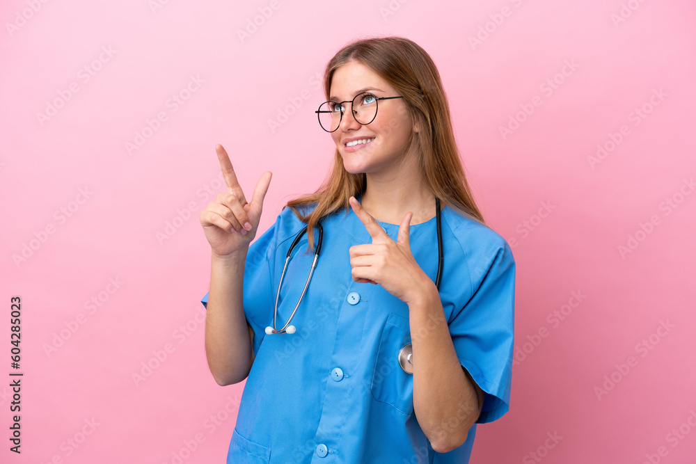 Young surgeon doctor woman isolated on pink background pointing with the index finger a great idea Young surgeon doctor woman isolated on pink background pointing with the index finger a great idea