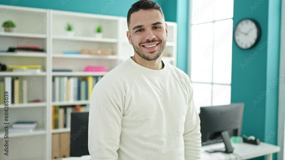 Young hispanic man student smiling confident standing at library university Young hispanic man student smiling confident standing at library university