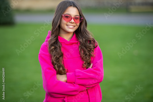 photo of fashion teen girl wearing hoodie. fashion teen girl outdoor. fashion teen girl © be free