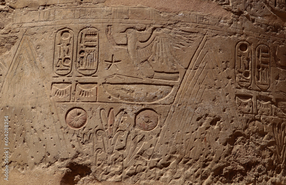 Ancient egyptian wall reliefs and pharaonic symbols carved at Karnak temple in Luxor, Egypt Ancient egyptian wall reliefs and pharaonic symbols carved at Karnak temple in Luxor, Egypt