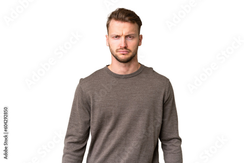 Young handsome caucasian man over isolated chroma key background with sad expression