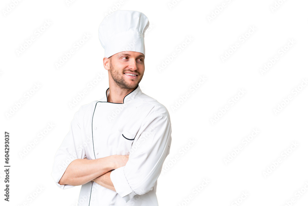 Young caucasian chef over isolated chroma key background with arms crossed and happy Young caucasian chef over isolated chroma key background with arms crossed and happy