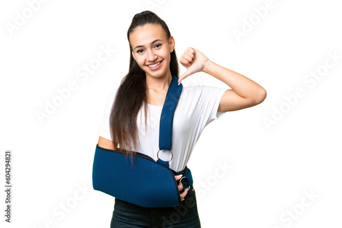 Young Arabian woman with broken arm and wearing a sling over isolated chroma key background proud and self-satisfied