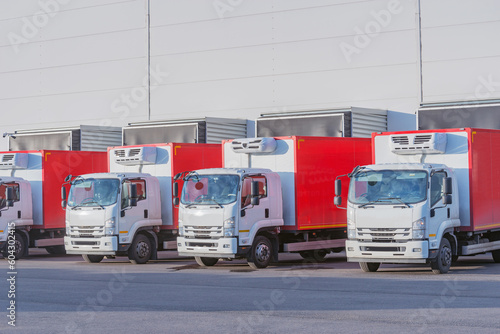 Freight trucks stand by the storage.