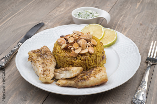 sayadieh, sayadiya, Rice with fish topped with almonds and tahini paste 