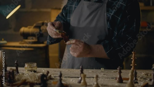 Wallpaper Mural Carpenter, Middle-aged man Skillfully Painting wood with protective paint In the workroom Steady camera movement Furniture assembly worker Working with wood pieces In a craftsman's workshop, forestry
 Torontodigital.ca