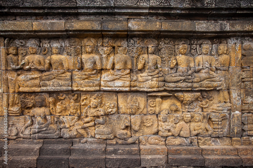 Reliefs on the walls of the Borobudur temple in Magelang, Central Java, Indonesia. there are about 1,400 relief panels, the reliefs depict the story of the Buddha and his teachings.