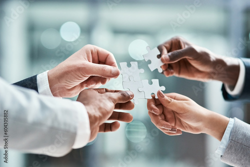 Solution, business puzzle and group of people hands for goals, project integration and workflow or success. Team building, progress and development of problem solving game, synergy or collaboration