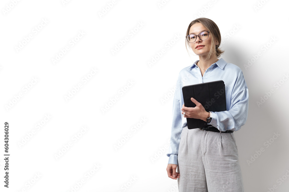 Young caucasian woman wearing eyeglasses, holding digital tablet, standing over white background Young caucasian woman wearing eyeglasses, holding digital tablet, standing over white background