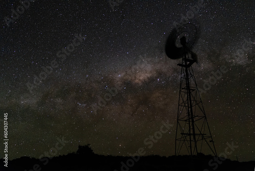 Canvas Print Night sky milky way galaxy with windmill silhouetted