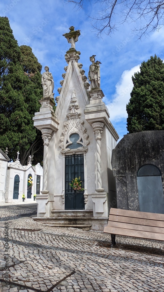 Beautiful large and tall crypt with statues on top of the cemetery in Lisbon
