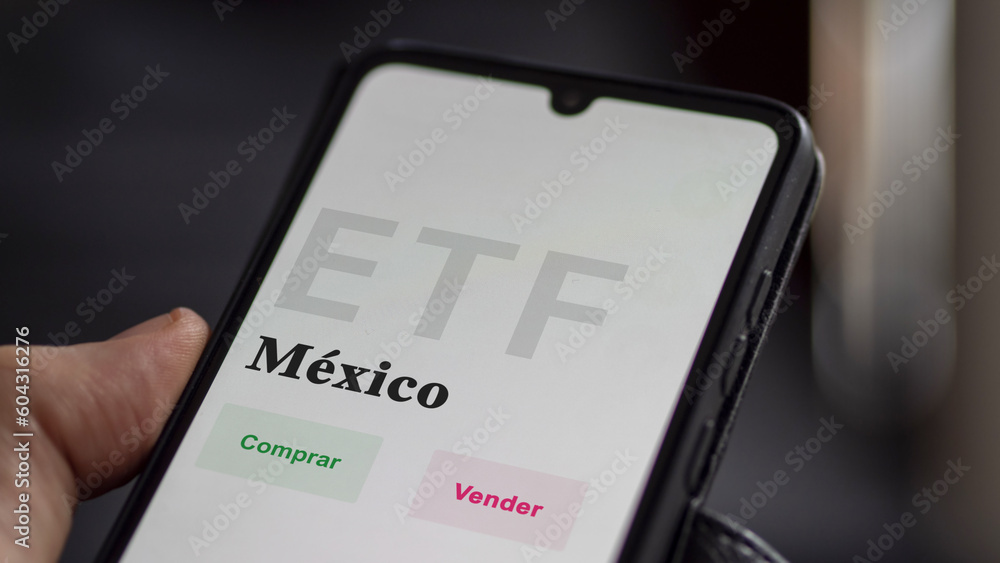 An investor analyzing an etf fund. ETF text in Spanish : Mexico, buy, sell. An investor analyzing an etf fund. ETF text in Spanish : Mexico, buy, sell.