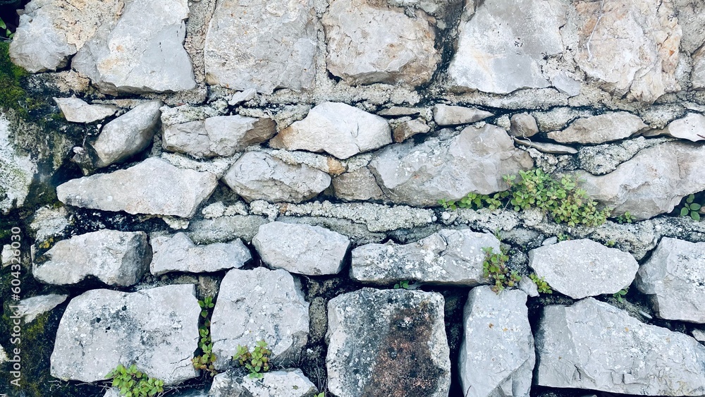Naklejka premium Wall of huge black and white stones